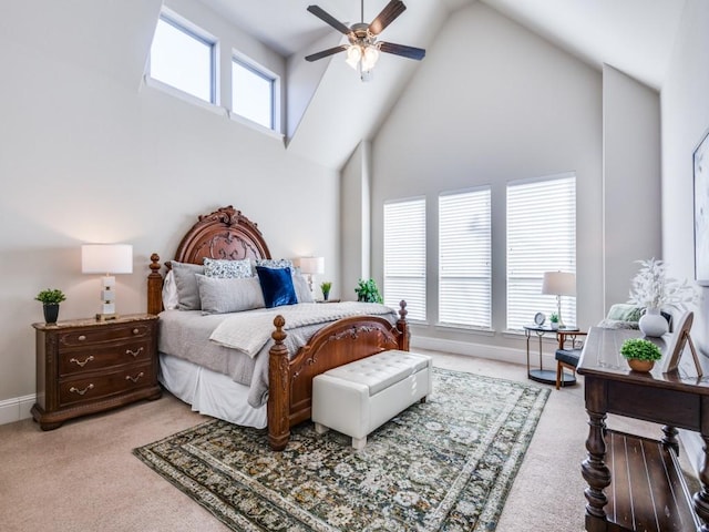 bedroom featuring light carpet, a towering ceiling, and ceiling fan