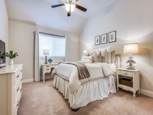 bedroom featuring ceiling fan, lofted ceiling, and light carpet