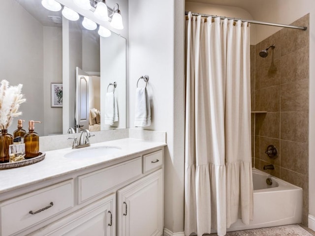 bathroom featuring vanity and shower / bath combination with curtain