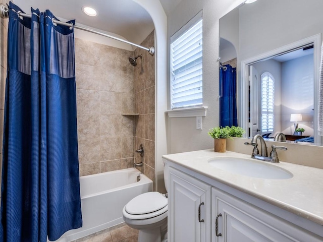 full bathroom featuring tile patterned floors, toilet, shower / tub combo, and vanity