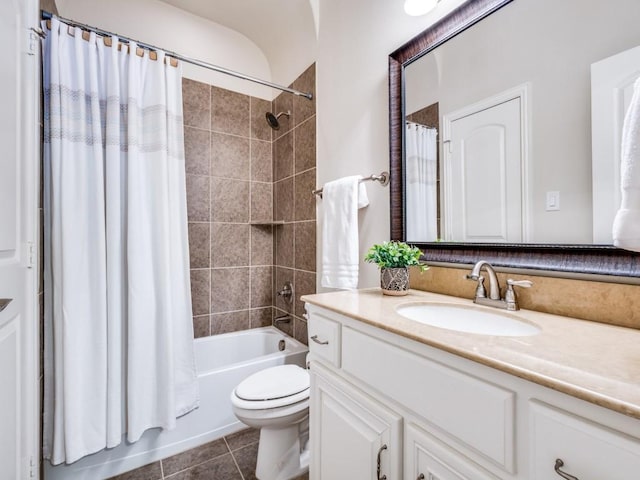 full bathroom with tile patterned floors, toilet, vanity, and shower / bath combo