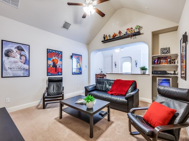 living room featuring ceiling fan, light colored carpet, and vaulted ceiling