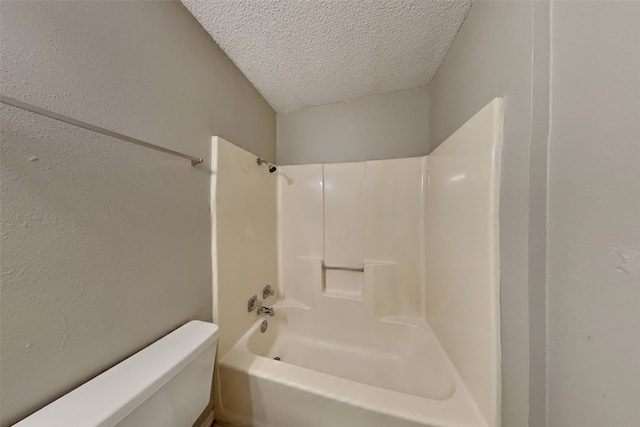 5014 Brookhollow Dr, Sachse, TX 75048 - full bathroom featuring toilet, a textured ceiling, and bathtub / shower combination