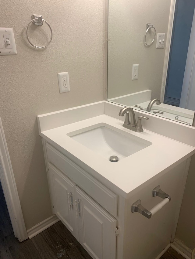 5014 Brookhollow Dr, Sachse, TX 75048 - bathroom with vanity and wood finished floors