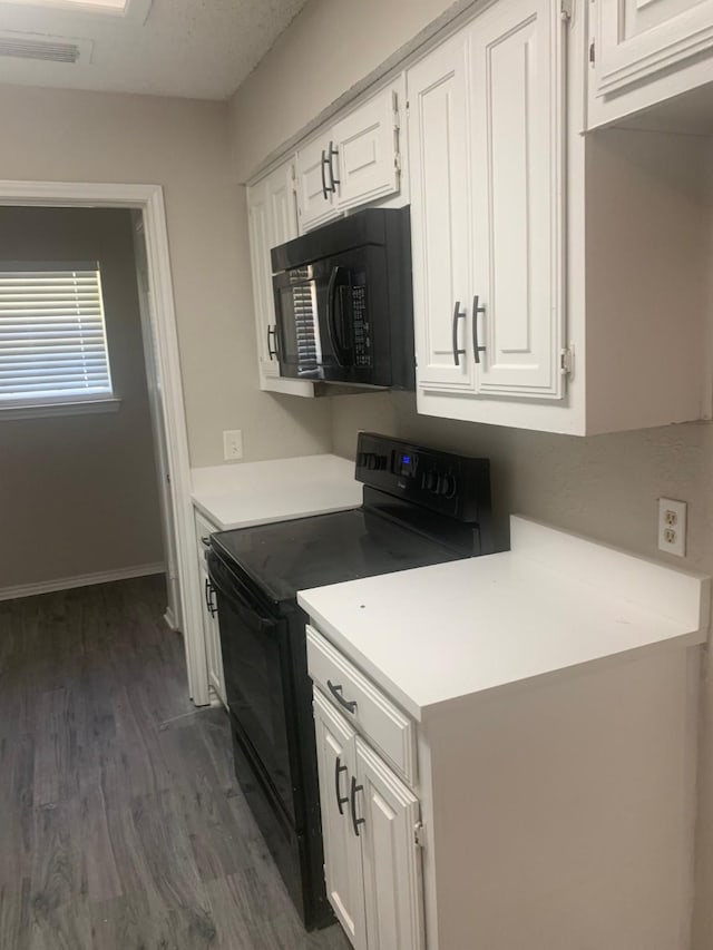 5014 Brookhollow Dr, Sachse, TX 75048 - kitchen featuring black appliances, white cabinetry, and dark wood-style floors