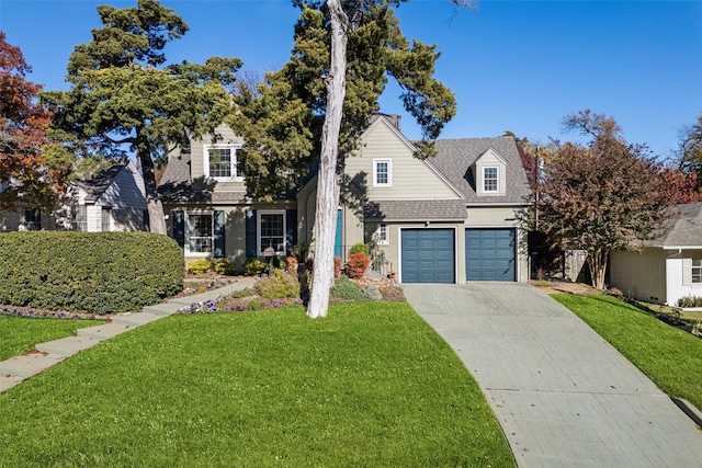 front facade featuring a garage and a front lawn