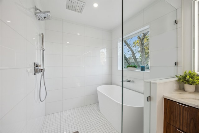 bathroom featuring tile patterned floors, vanity, and separate shower and tub