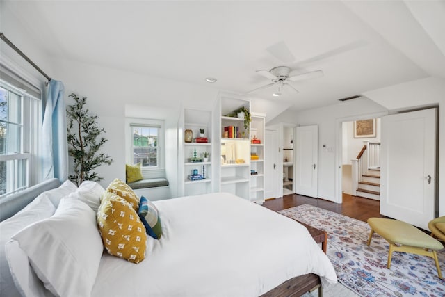 bedroom featuring dark hardwood / wood-style floors and ceiling fan