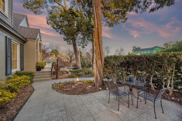 view of patio terrace at dusk