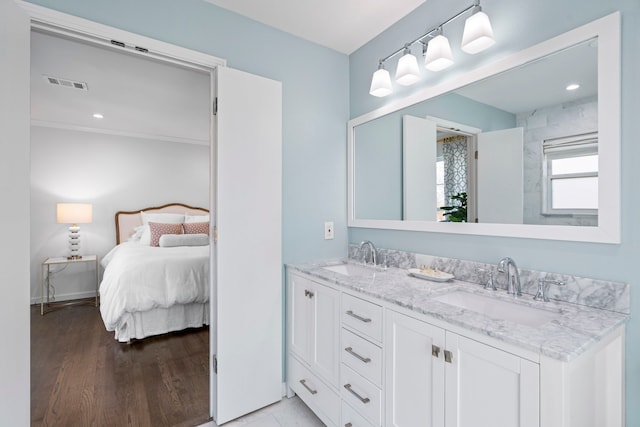 bathroom featuring vanity and hardwood / wood-style floors