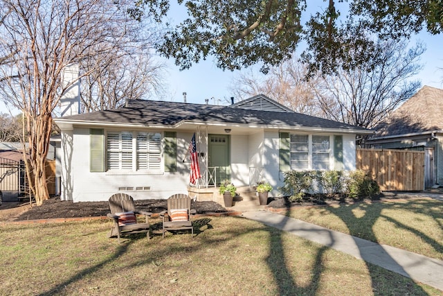 single story home featuring a front yard