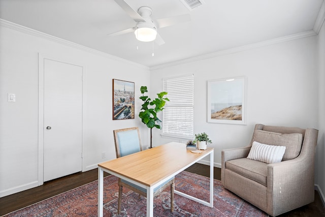 office space with dark wood-type flooring, ceiling fan, and ornamental molding