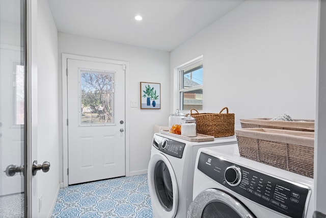 laundry room with separate washer and dryer and light tile patterned floors