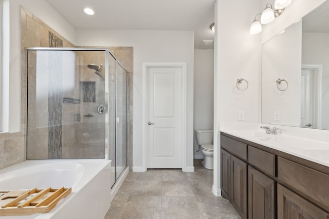 full bathroom featuring vanity, toilet, and independent shower and bath