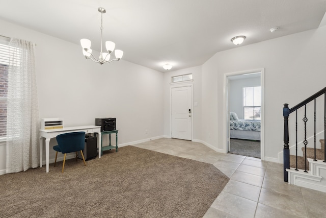 entrance foyer with light tile patterned flooring and a chandelier