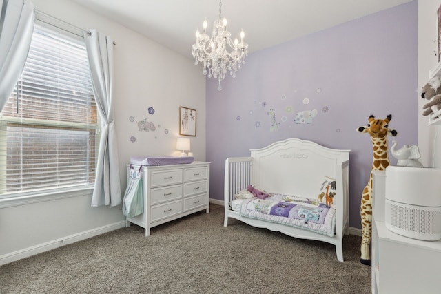 carpeted bedroom with a chandelier