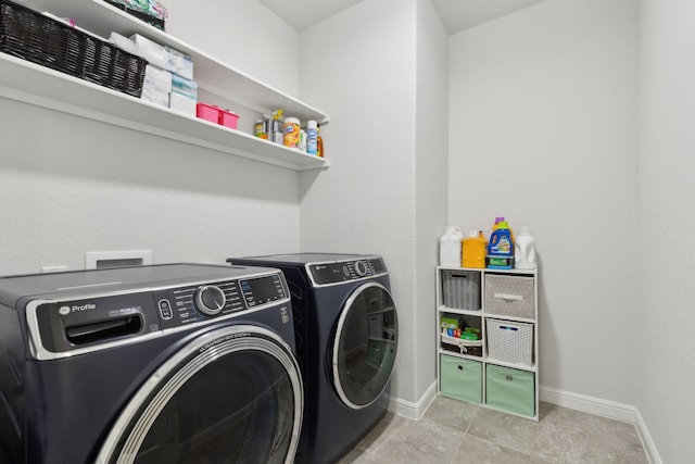 laundry area with washing machine and clothes dryer