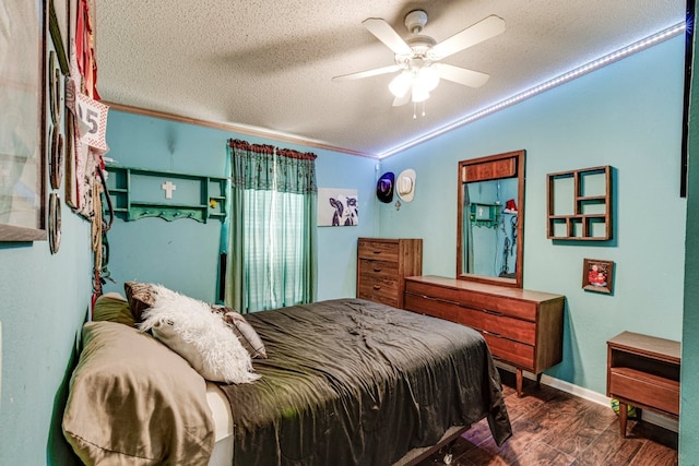 bedroom with hardwood / wood-style flooring, crown molding, a textured ceiling, and ceiling fan