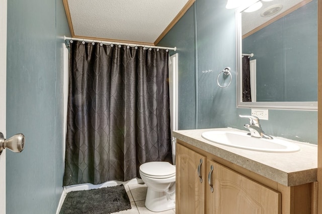 bathroom featuring vanity, ornamental molding, a textured ceiling, tile patterned floors, and toilet