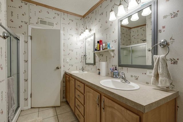 bathroom with an enclosed shower, crown molding, a textured ceiling, vanity, and tile patterned flooring