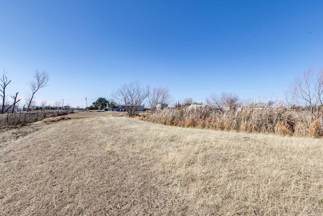 view of yard with a rural view