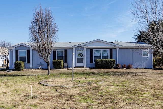 ranch-style house with a front lawn