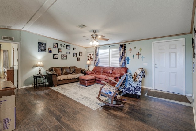 living room with crown molding, lofted ceiling, dark hardwood / wood-style flooring, and a textured ceiling