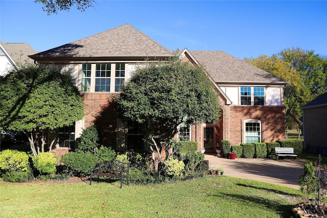 view of front facade with a patio and a front yard