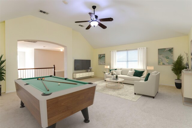 unfurnished living room with ceiling fan with notable chandelier, light hardwood / wood-style floors, and a towering ceiling