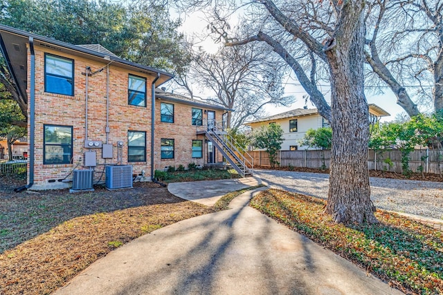 view of front of home featuring central AC and a patio area