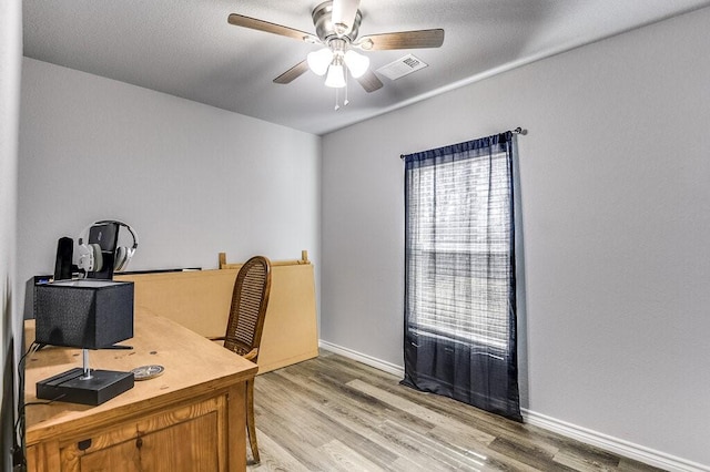 office featuring ceiling fan and light hardwood / wood-style floors