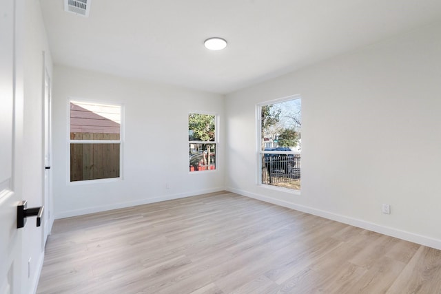 unfurnished room featuring light hardwood / wood-style floors