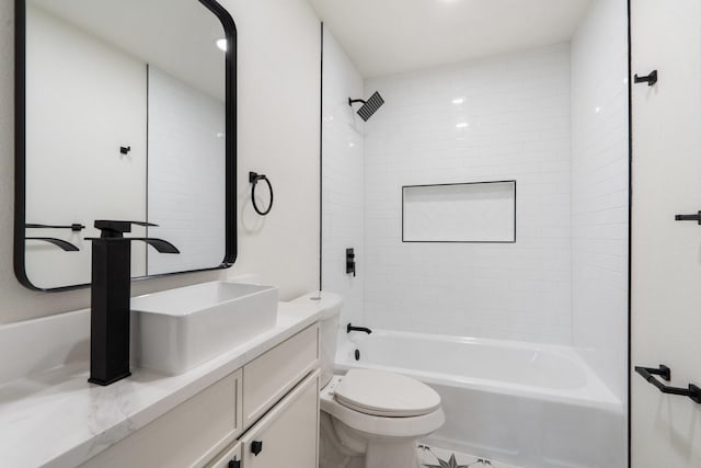 full bathroom with tiled shower / bath combo, vanity, and toilet