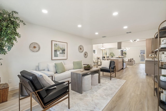 living room with light hardwood / wood-style floors