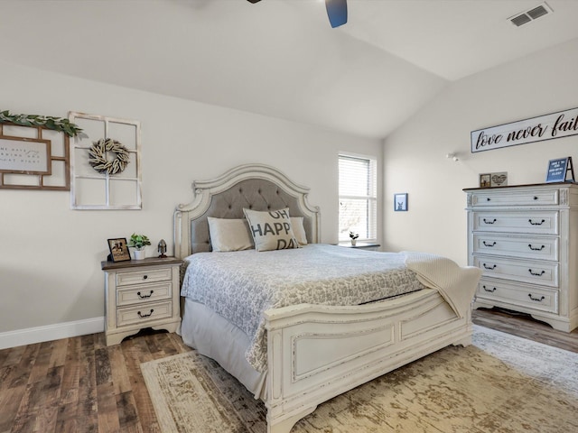 bedroom with lofted ceiling, dark hardwood / wood-style floors, and ceiling fan