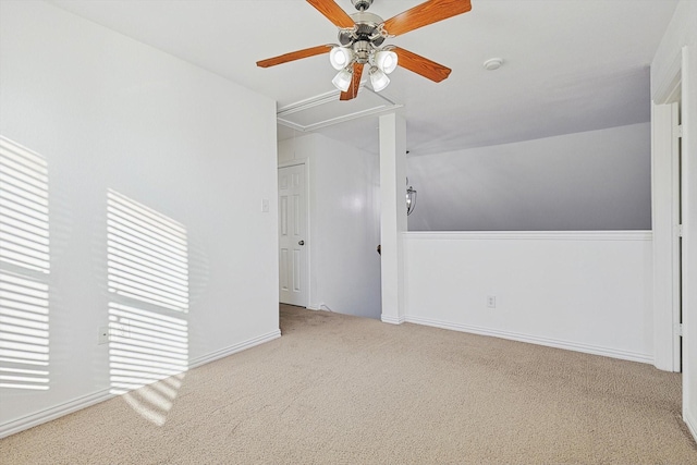 additional living space with ceiling fan and light colored carpet