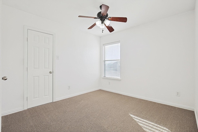 empty room featuring carpet and ceiling fan