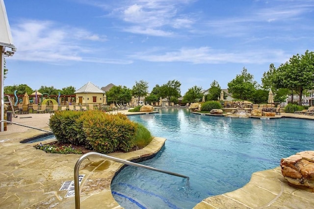 view of swimming pool featuring a patio area