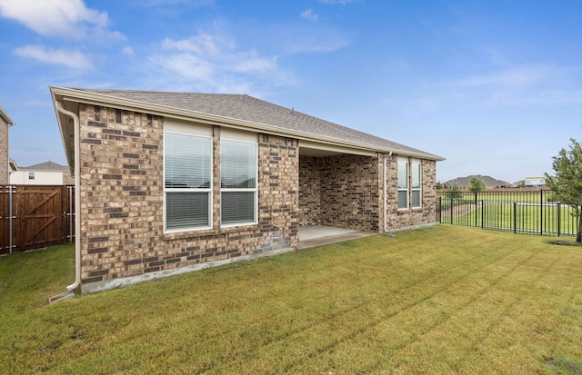 1811 Sideoat Ln, Princeton, TX 75407 - back of house with a fenced backyard and brick siding