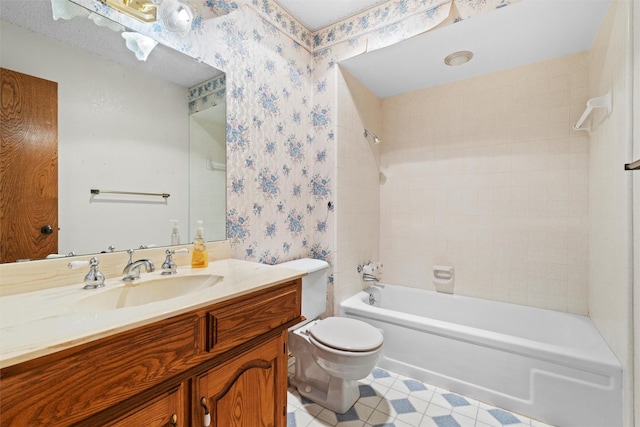 full bathroom featuring vanity, bathing tub / shower combination, and toilet