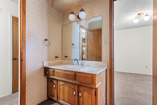 bathroom featuring vanity and a textured ceiling