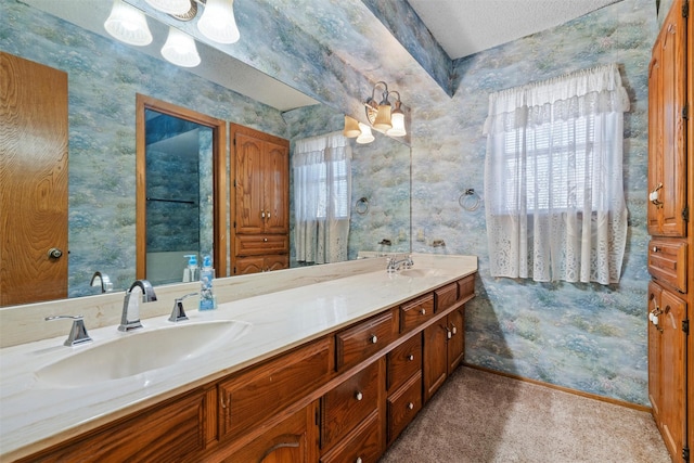 bathroom featuring vanity and a textured ceiling