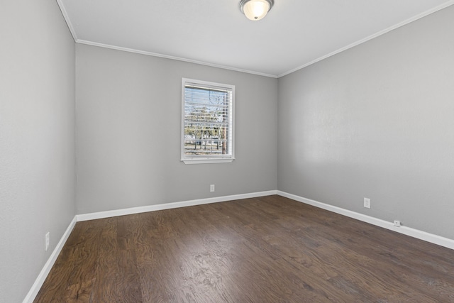 unfurnished room featuring ornamental molding and dark hardwood / wood-style flooring