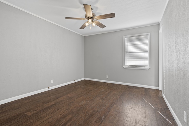 unfurnished room featuring crown molding, dark wood-type flooring, and ceiling fan