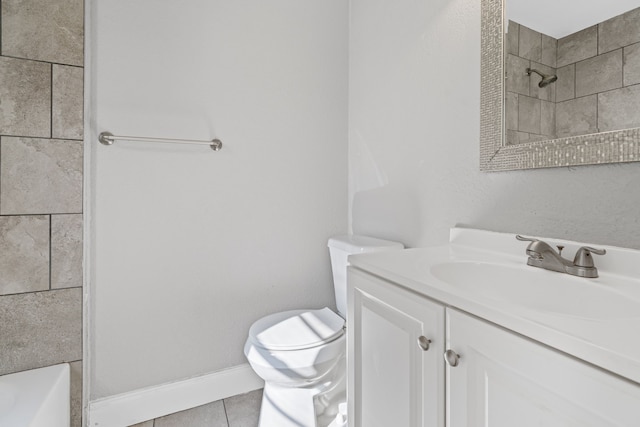 bathroom with tile patterned flooring, vanity, and toilet