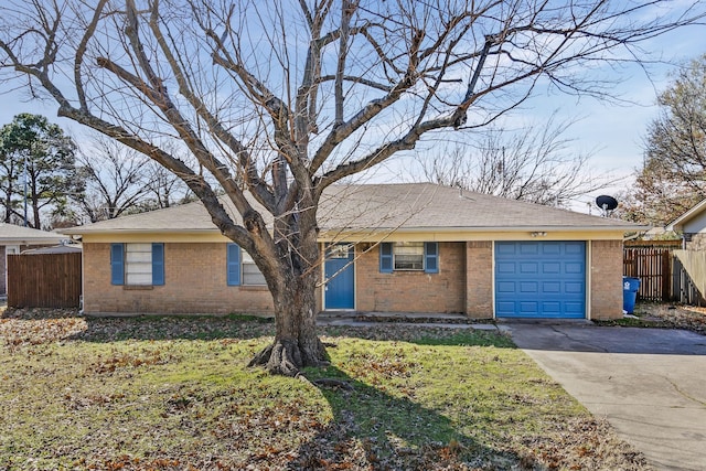 ranch-style home with a garage and a front yard