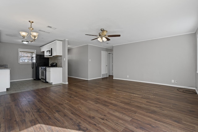 unfurnished living room with ornamental molding, ceiling fan with notable chandelier, and dark hardwood / wood-style flooring