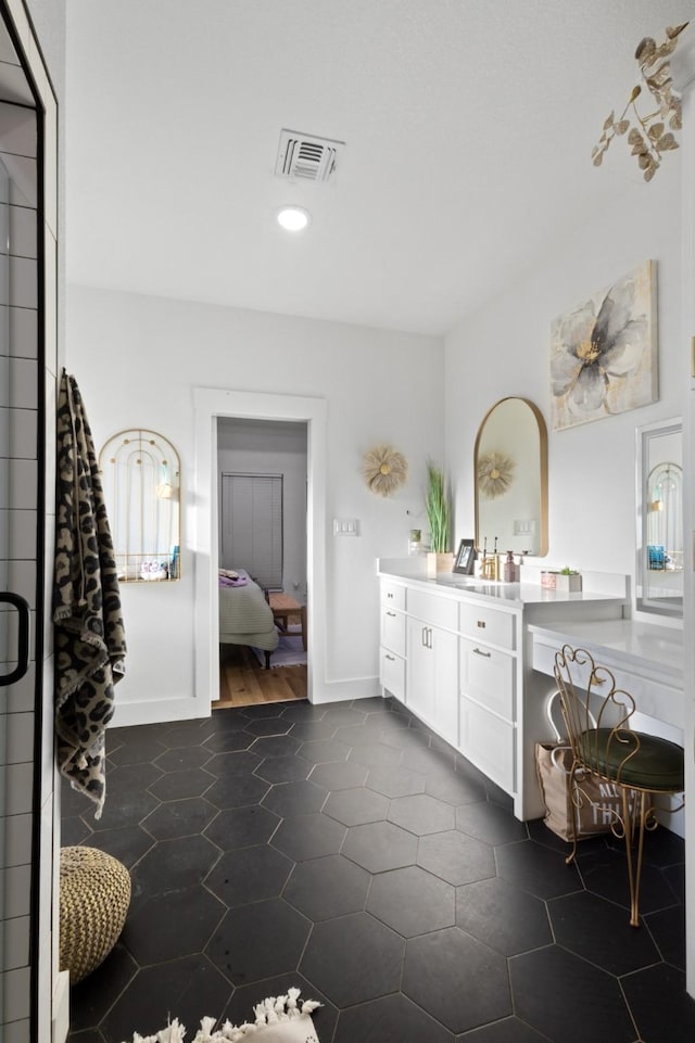 bathroom with vanity and tile patterned floors