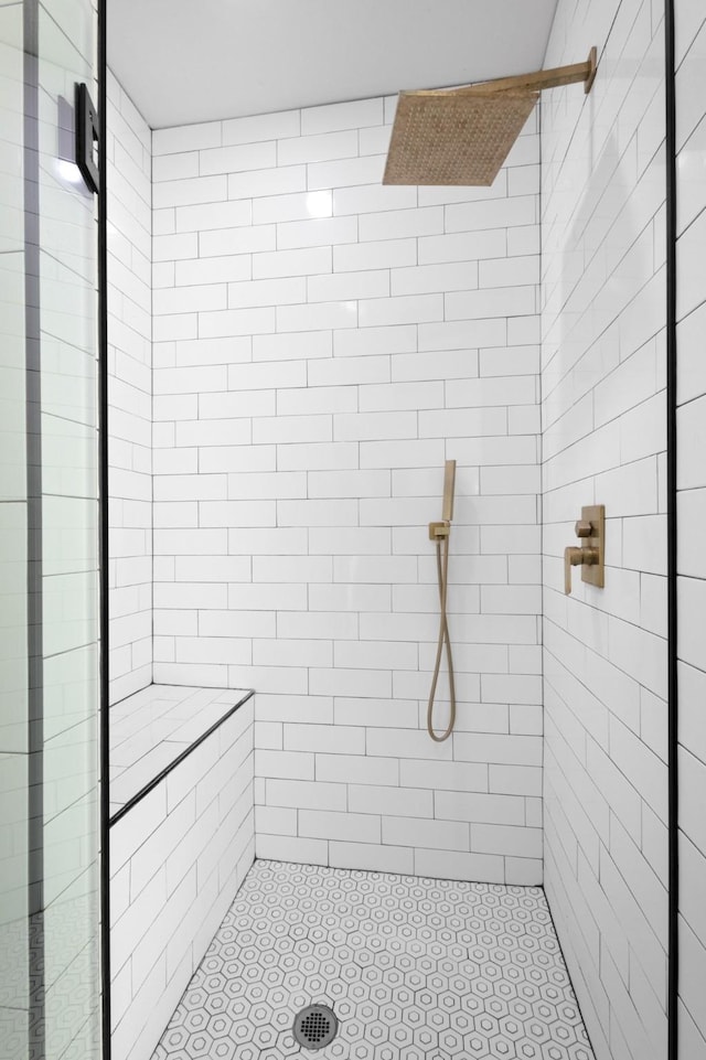 bathroom with tiled shower