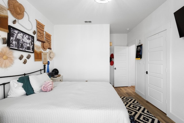 bedroom featuring hardwood / wood-style floors